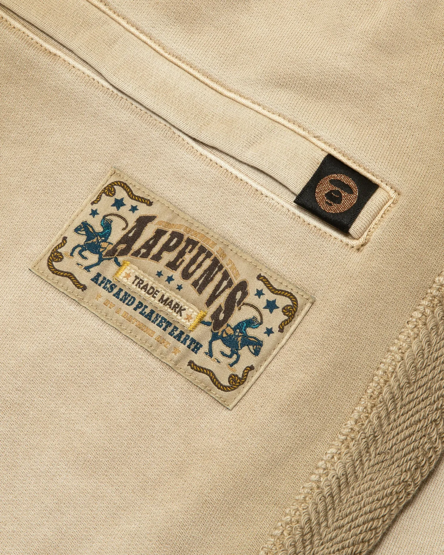 AAPEUNVS moonface logo sweat pants