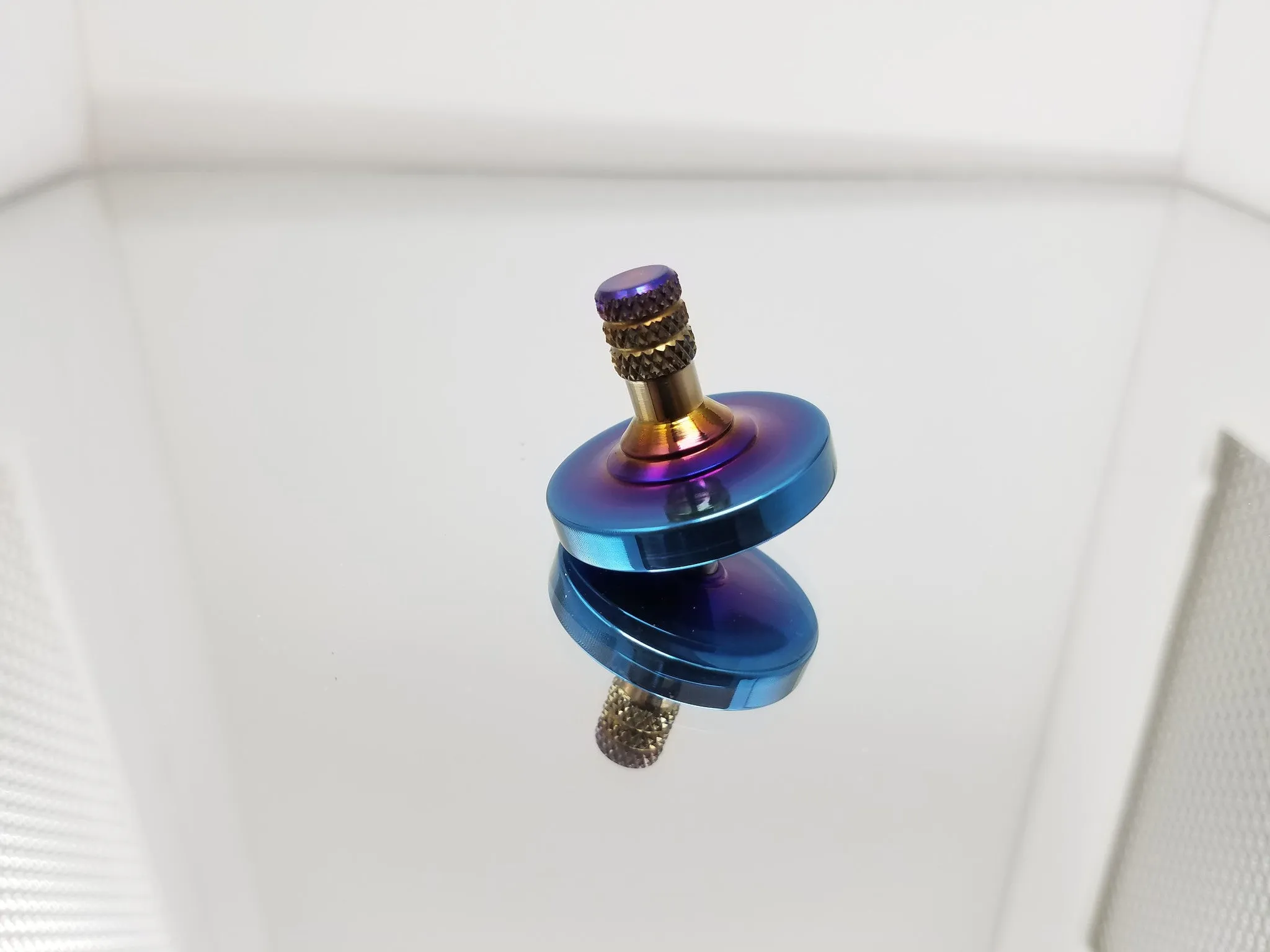Titanium Spinning Top with a Heat Anodized Finish
