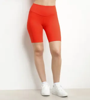 Women's sports cyclist in orange sculpting microfibre Dim Move